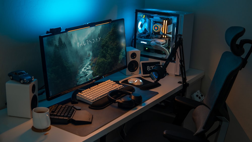 a computer desk with a monitor and keyboard