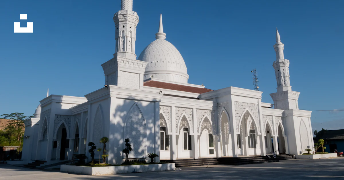 A large white building with two towers and a dome photo – Free ...