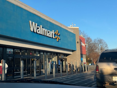 a walmart store with a car parked in front of it