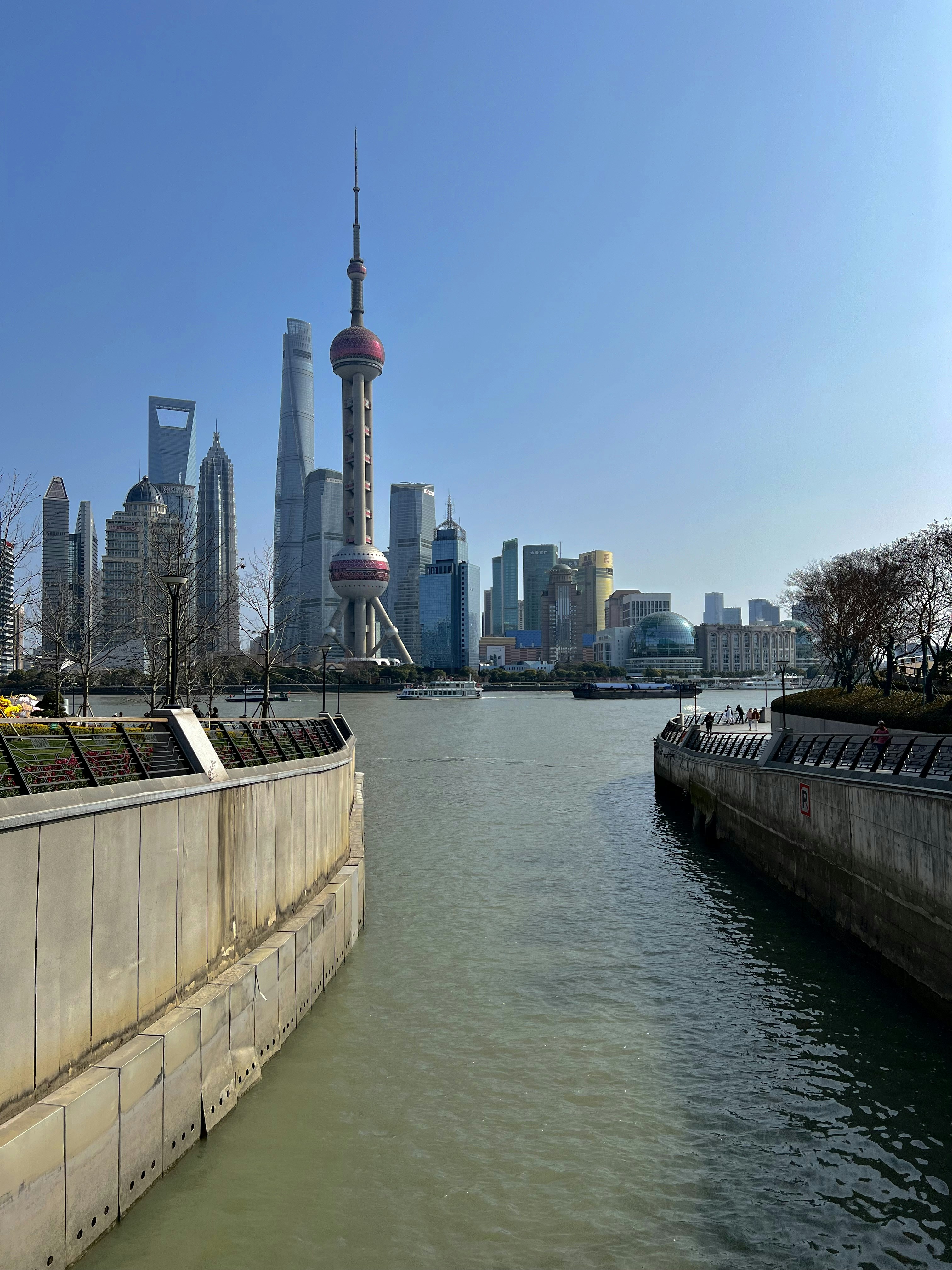 a body of water with a city in the background