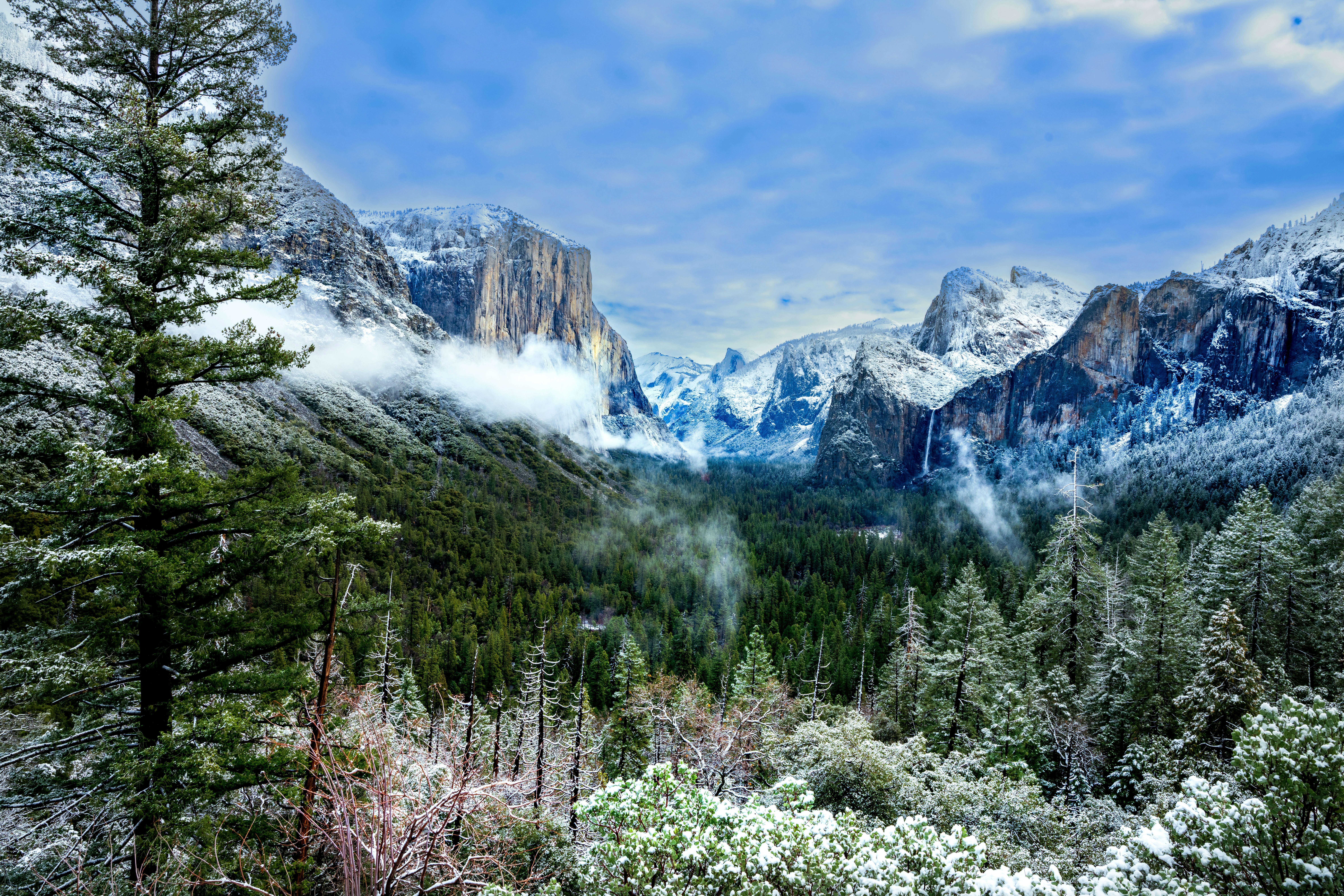 A view of a mountain range covered in snow photo – Free Land Image on ...