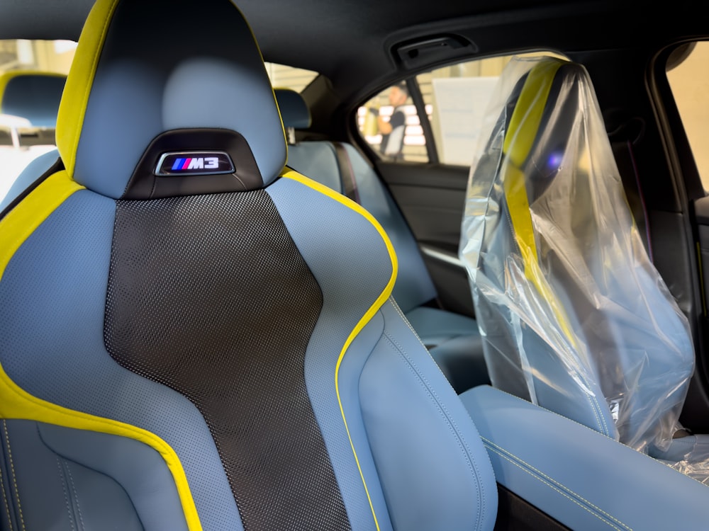 the interior of a car with yellow trim