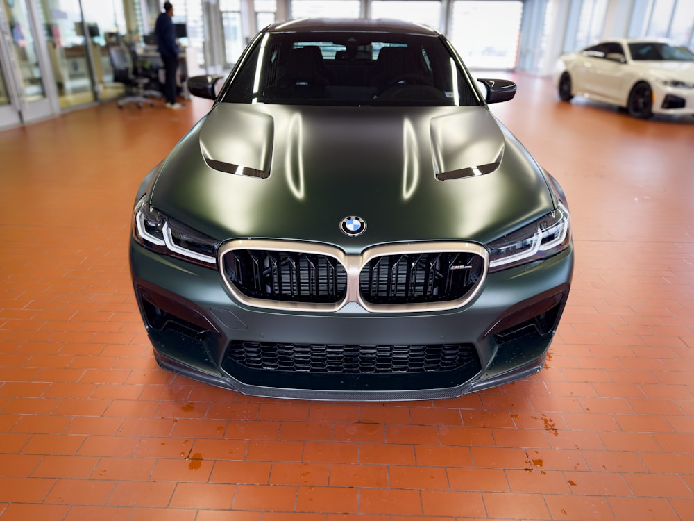 the front of a bmw car in a showroom