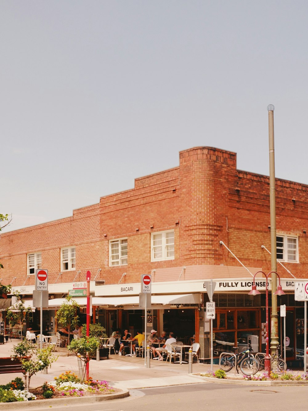 a red brick building sitting on the corner of a street