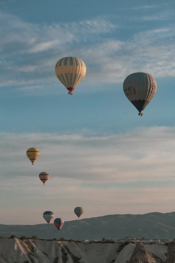 Hot air balloon over Marrakech desert at sunrise