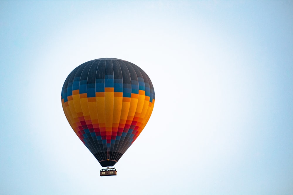 a colorful hot air balloon flying in the sky