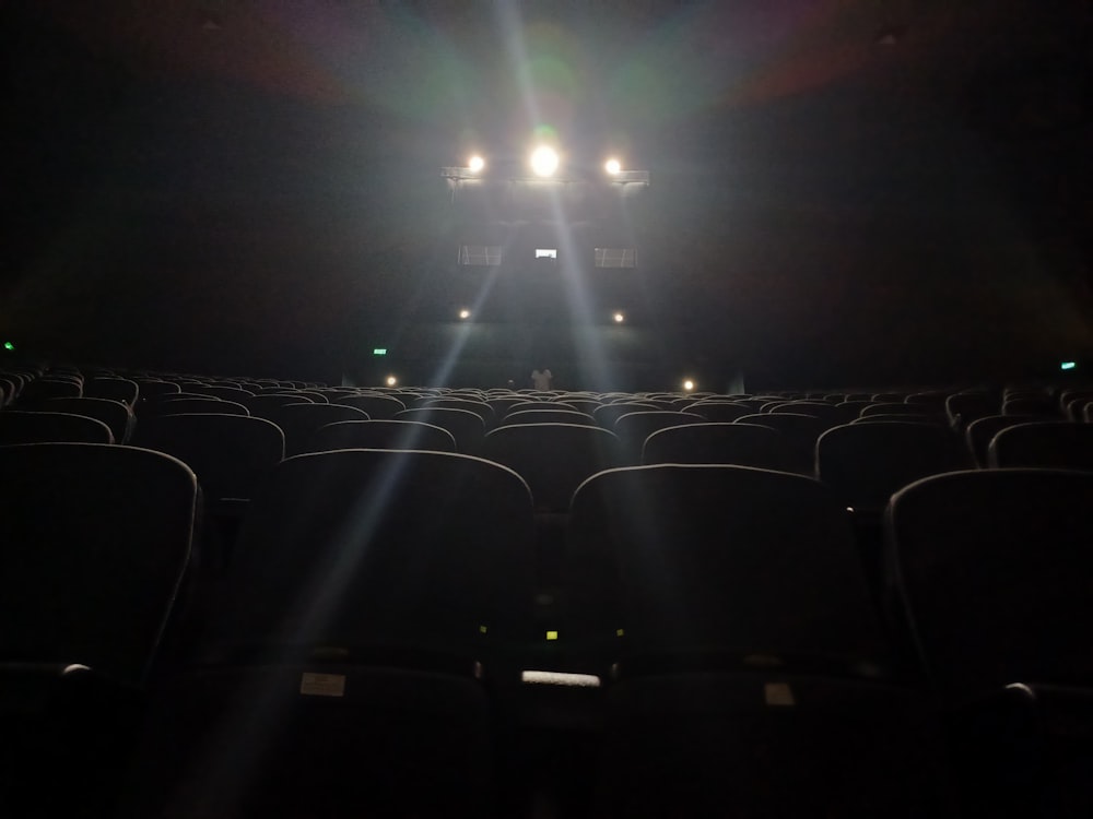 an empty theater with the lights on