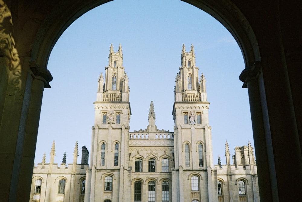 a view of a large building through an arch