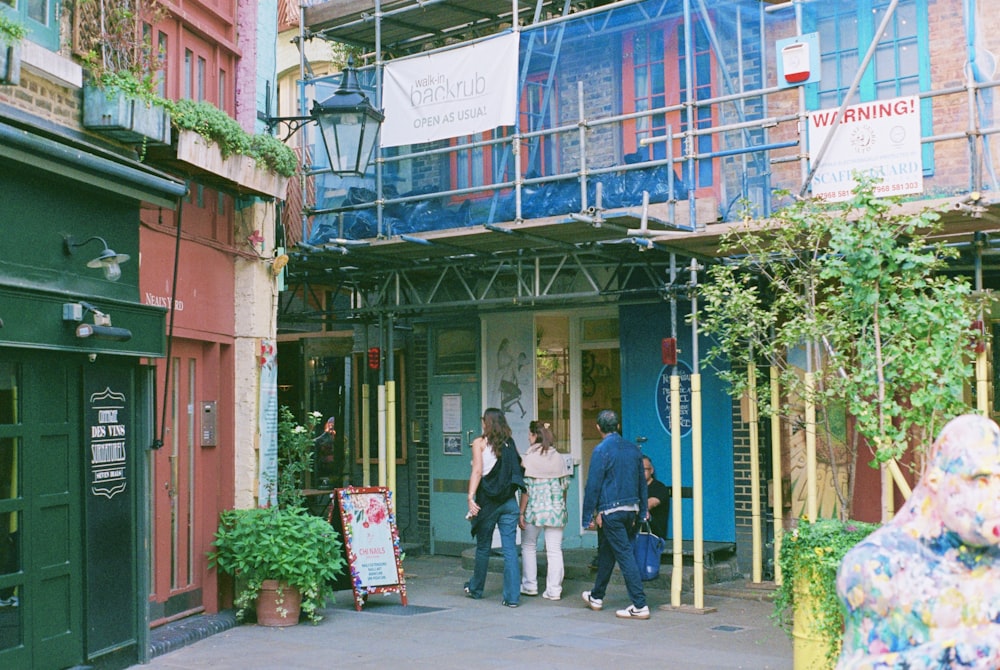 a group of people standing outside of a building