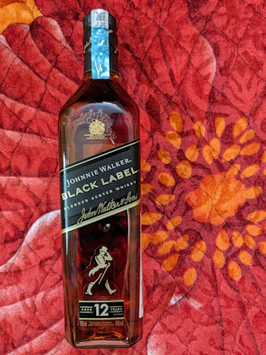 a bottle of black label 12 year old