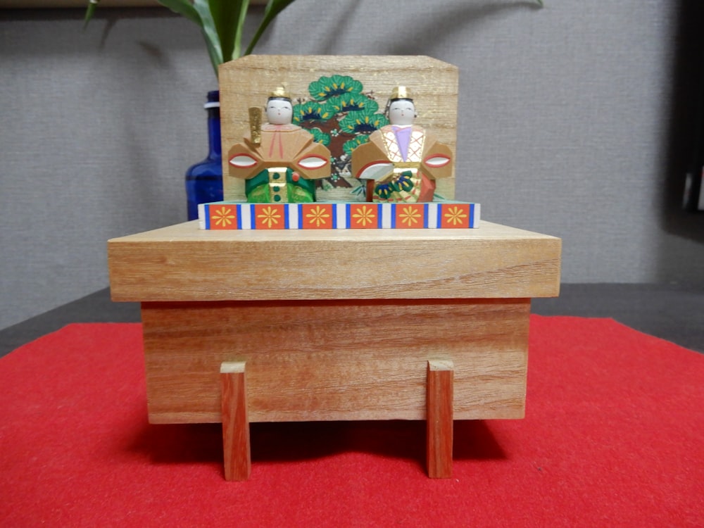 a wooden stand with a card holder on top of it