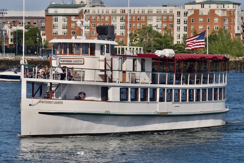 a large white boat floating on top of a body of water