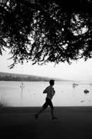 a man running near a body of water