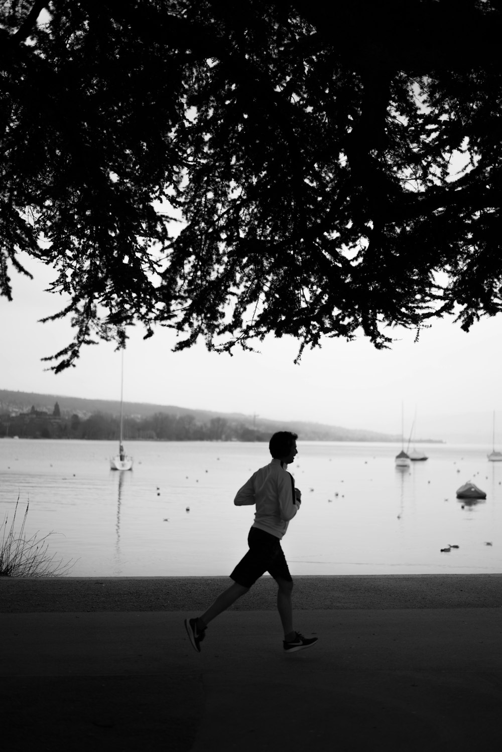 a man running near a body of water