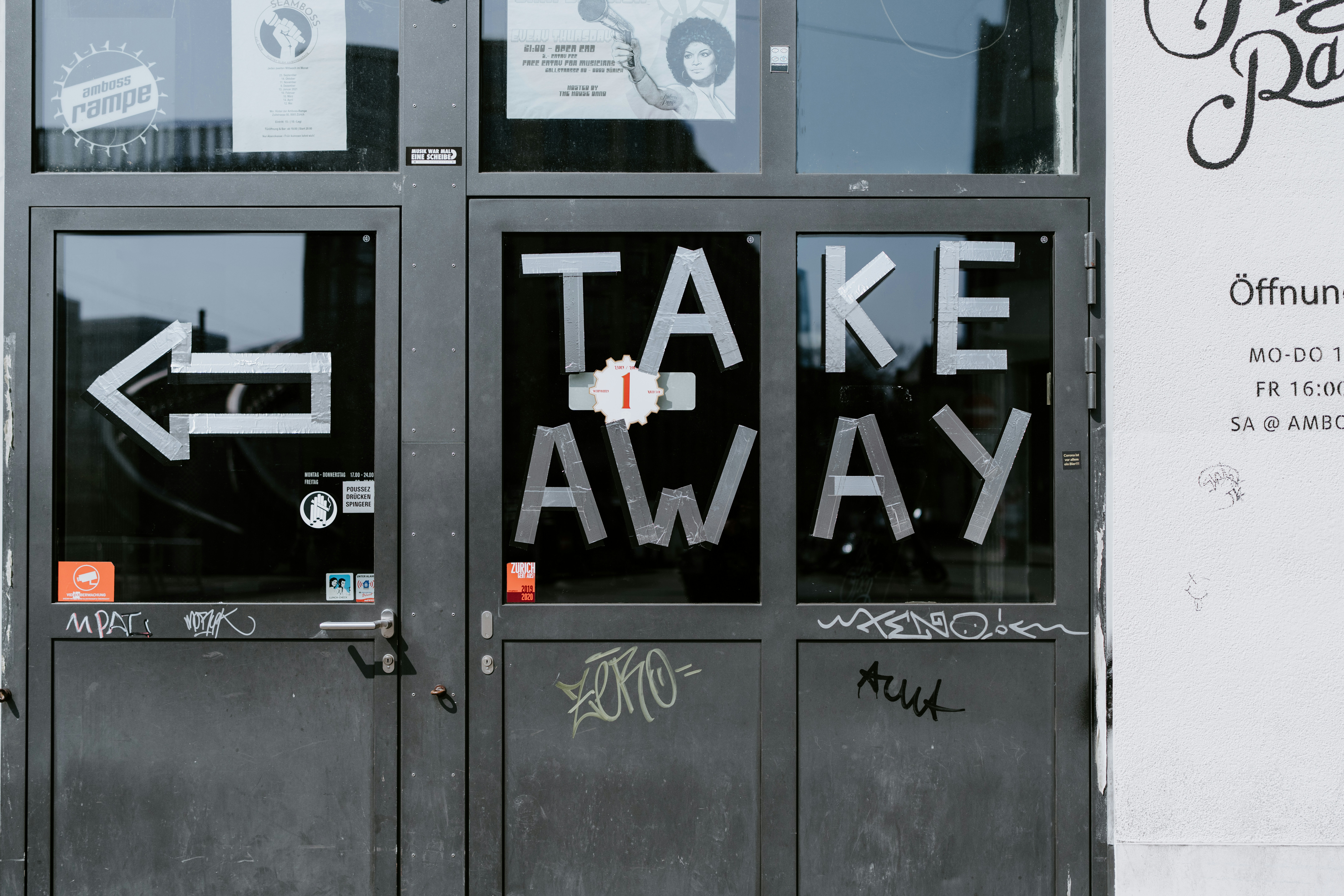a door with graffiti written on it that says take away