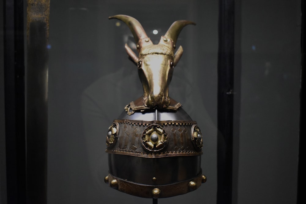 a helmet with a goat's head on top of it