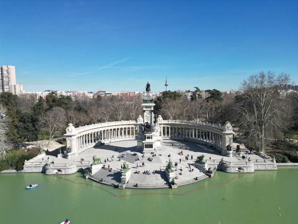 an aerial view of a park with a fountain