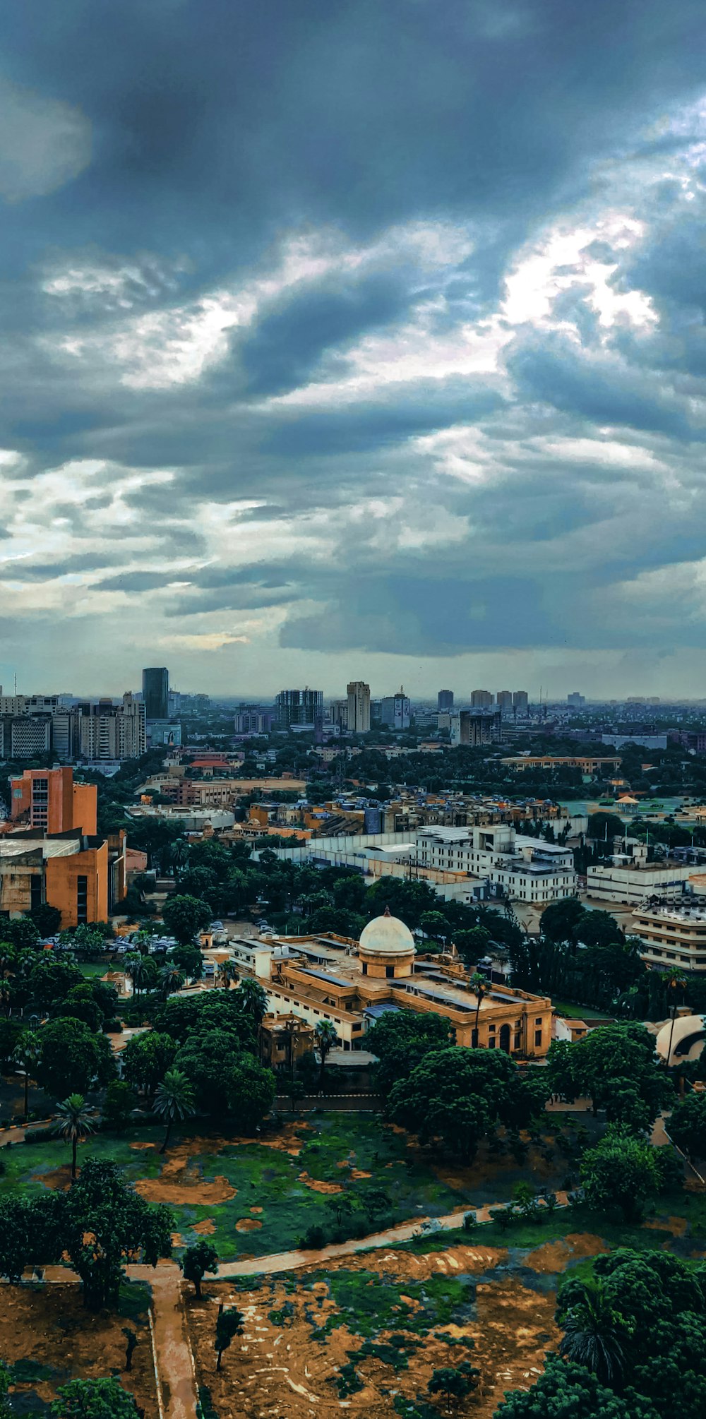 a view of a city with a cloudy sky