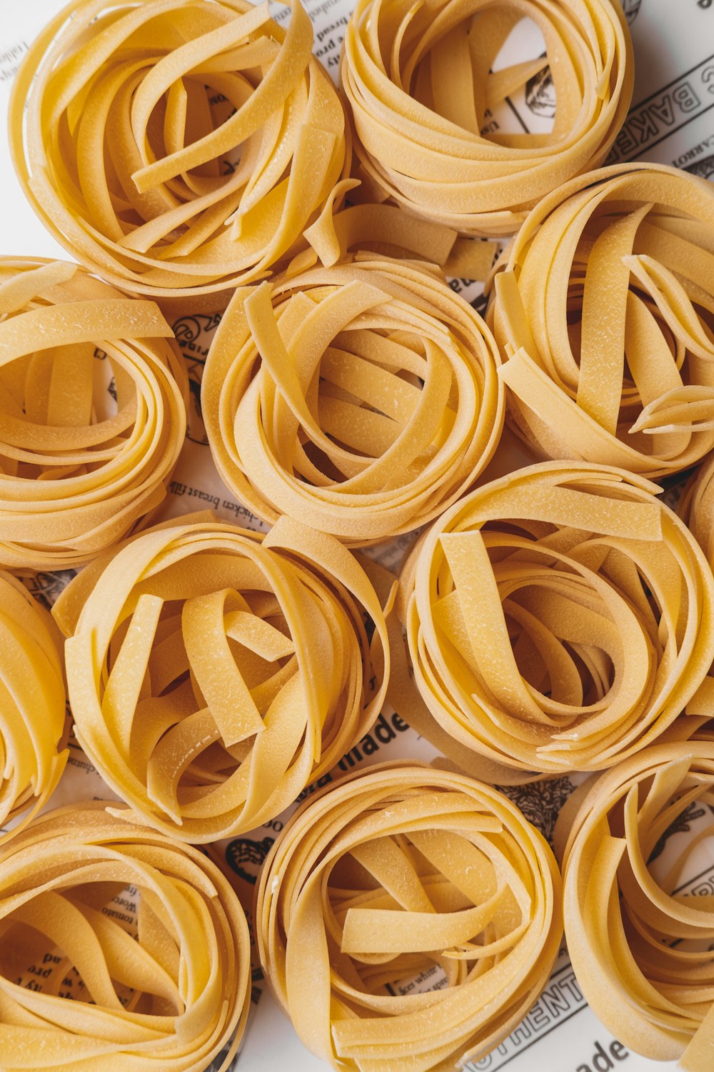 a pile of rolled up noodles on top of a table