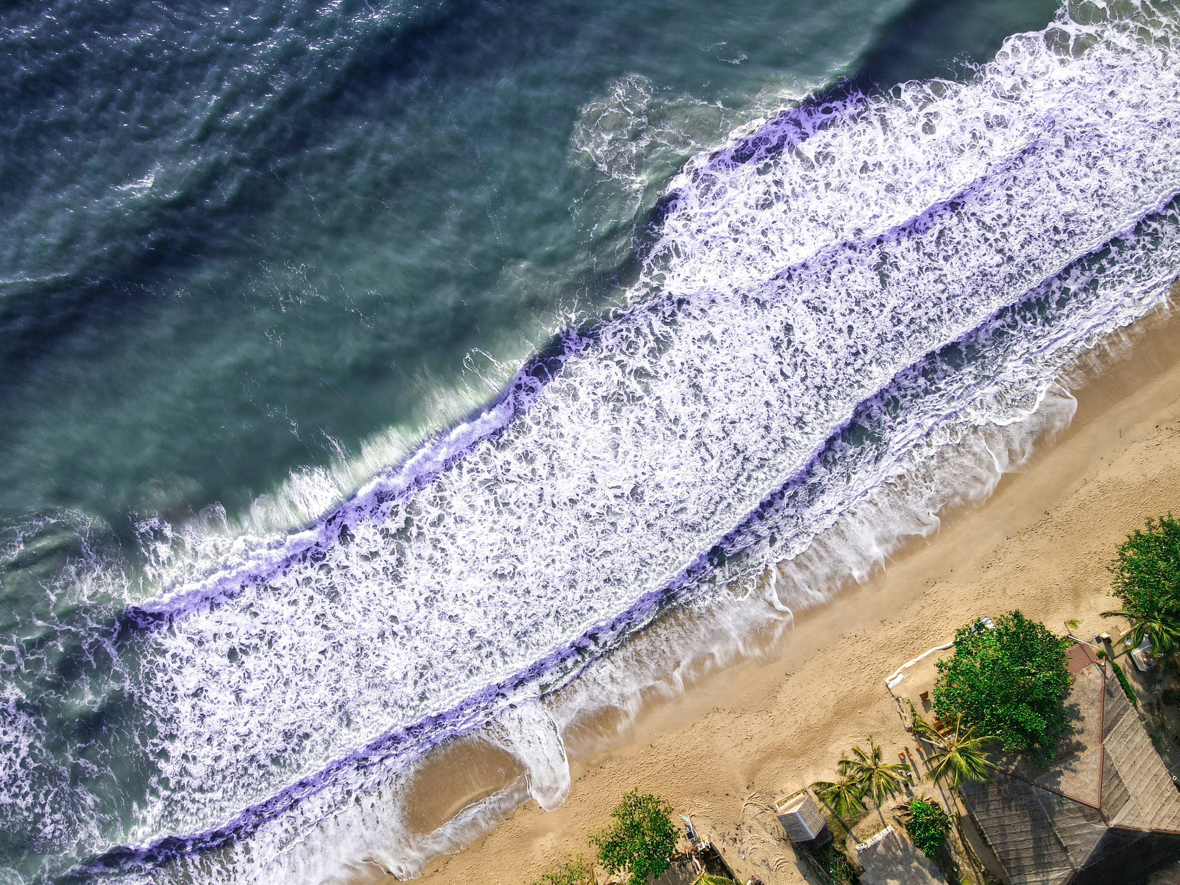 an aerial view of a beach and ocean