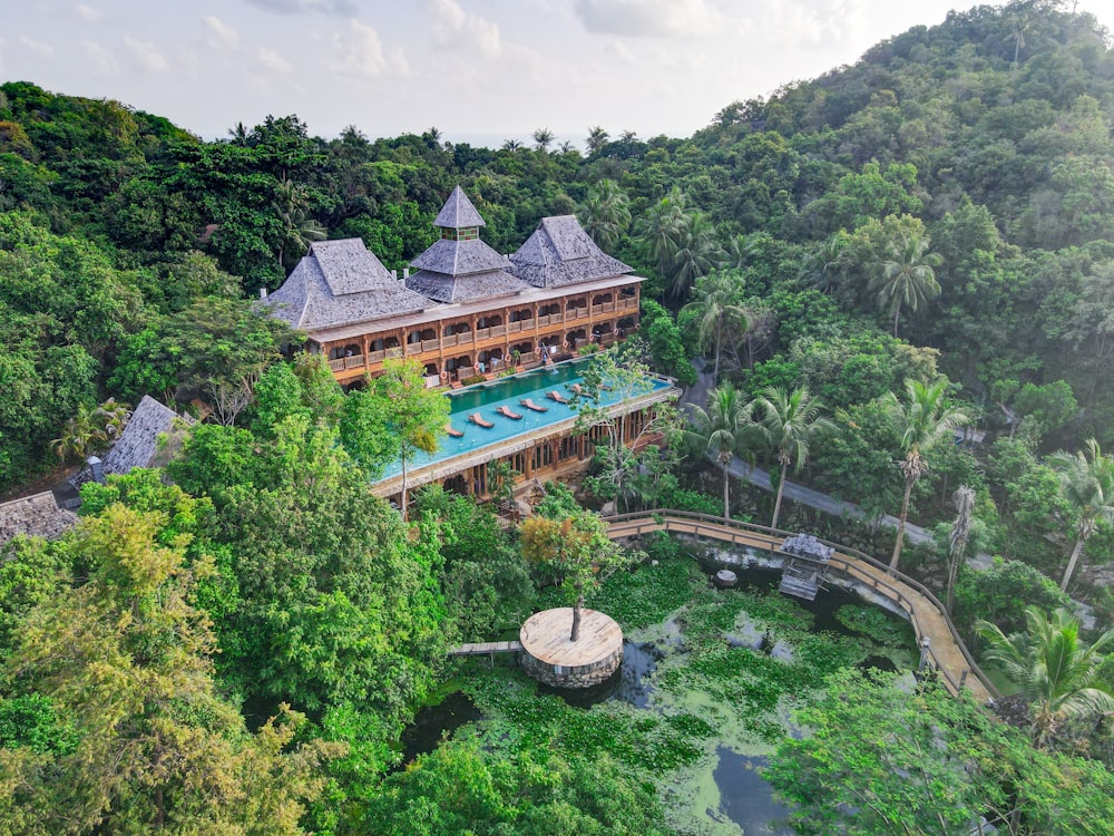 an aerial view of a resort surrounded by trees