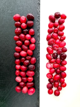 a bunch of cranberries sitting next to each other
