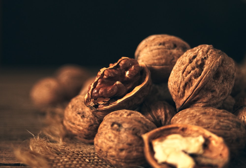 a pile of walnuts sitting on top of a table