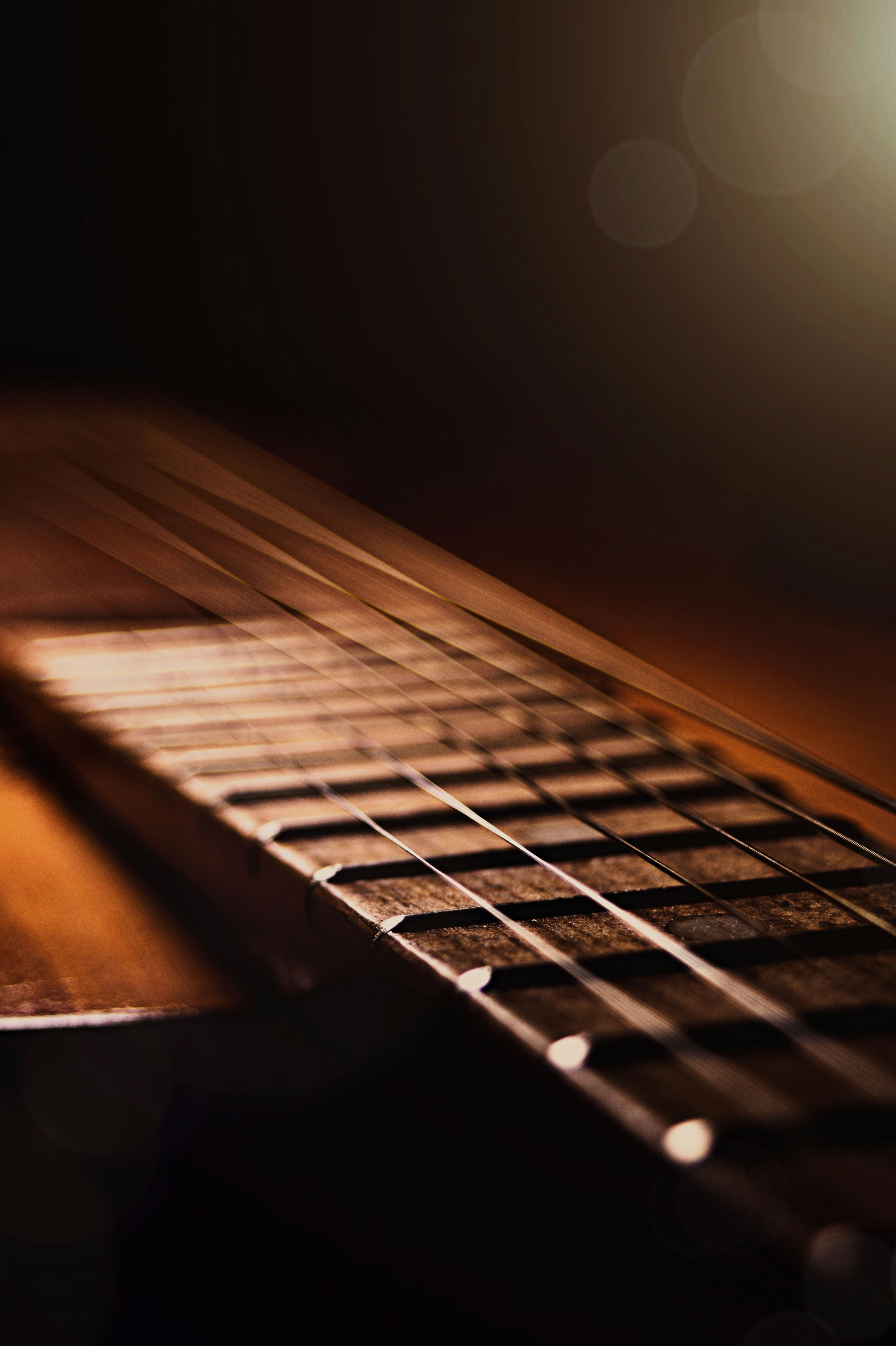 a close up of a guitar's neck and frets