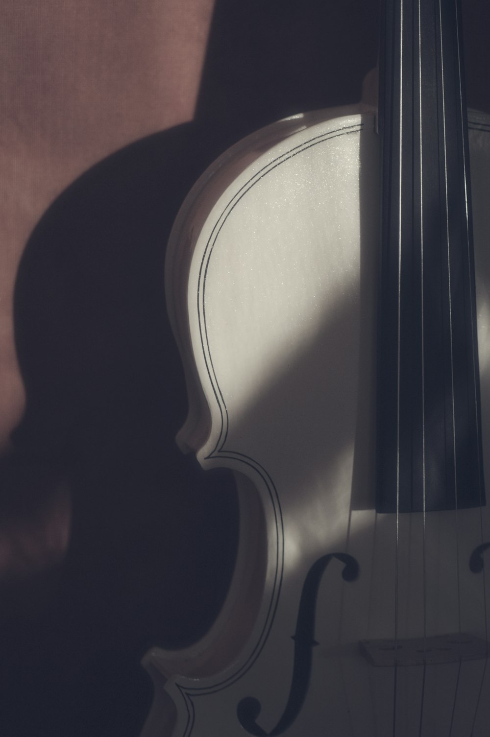a close up of a violin on a table