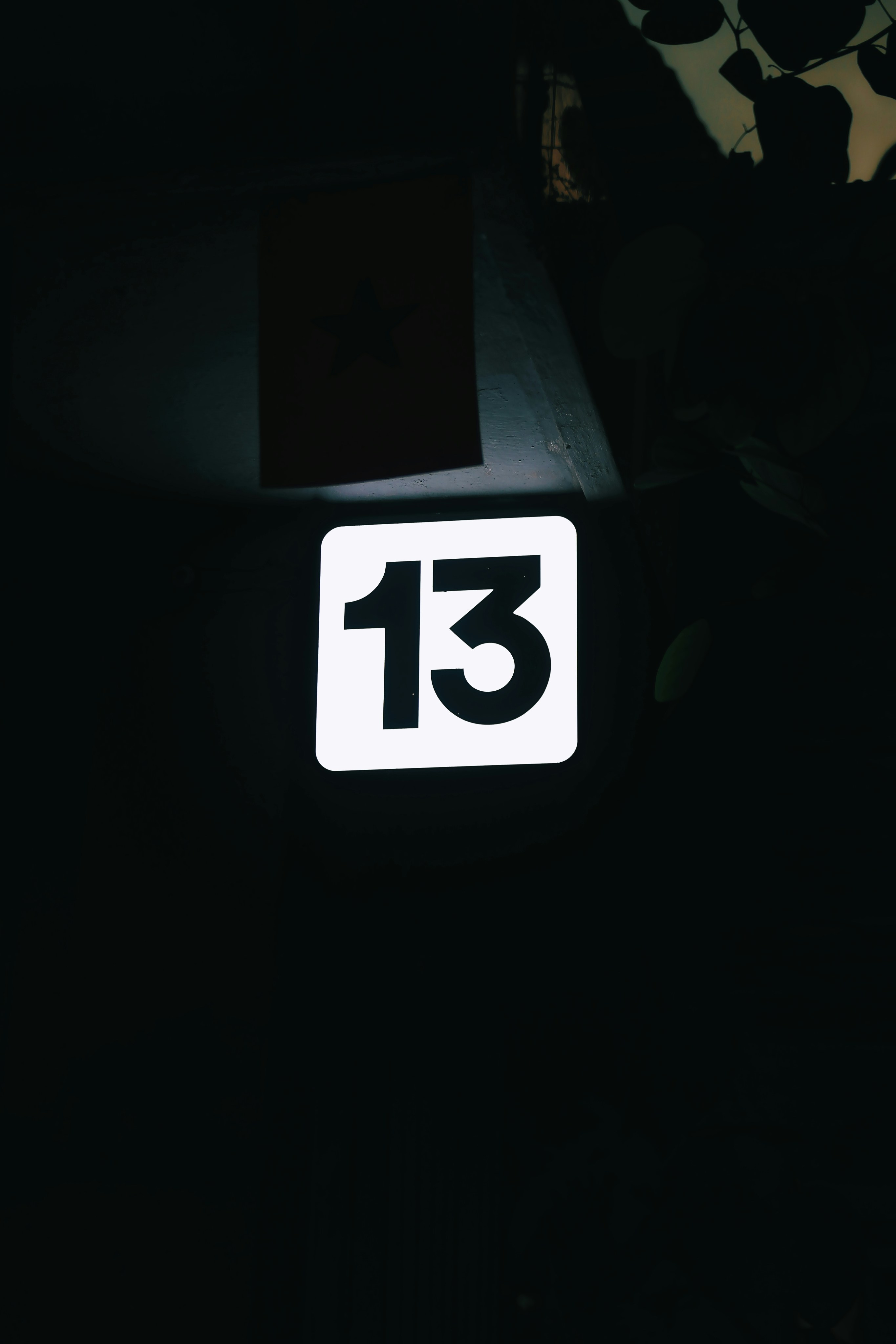a close up of a street sign in the dark