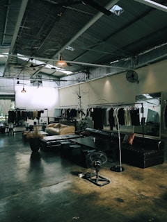 a room filled with lots of furniture and a mirror