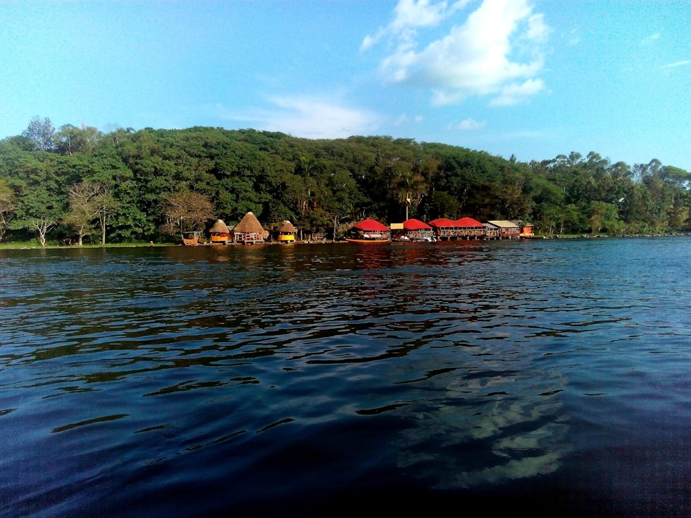 a row of houses sitting on top of a lake