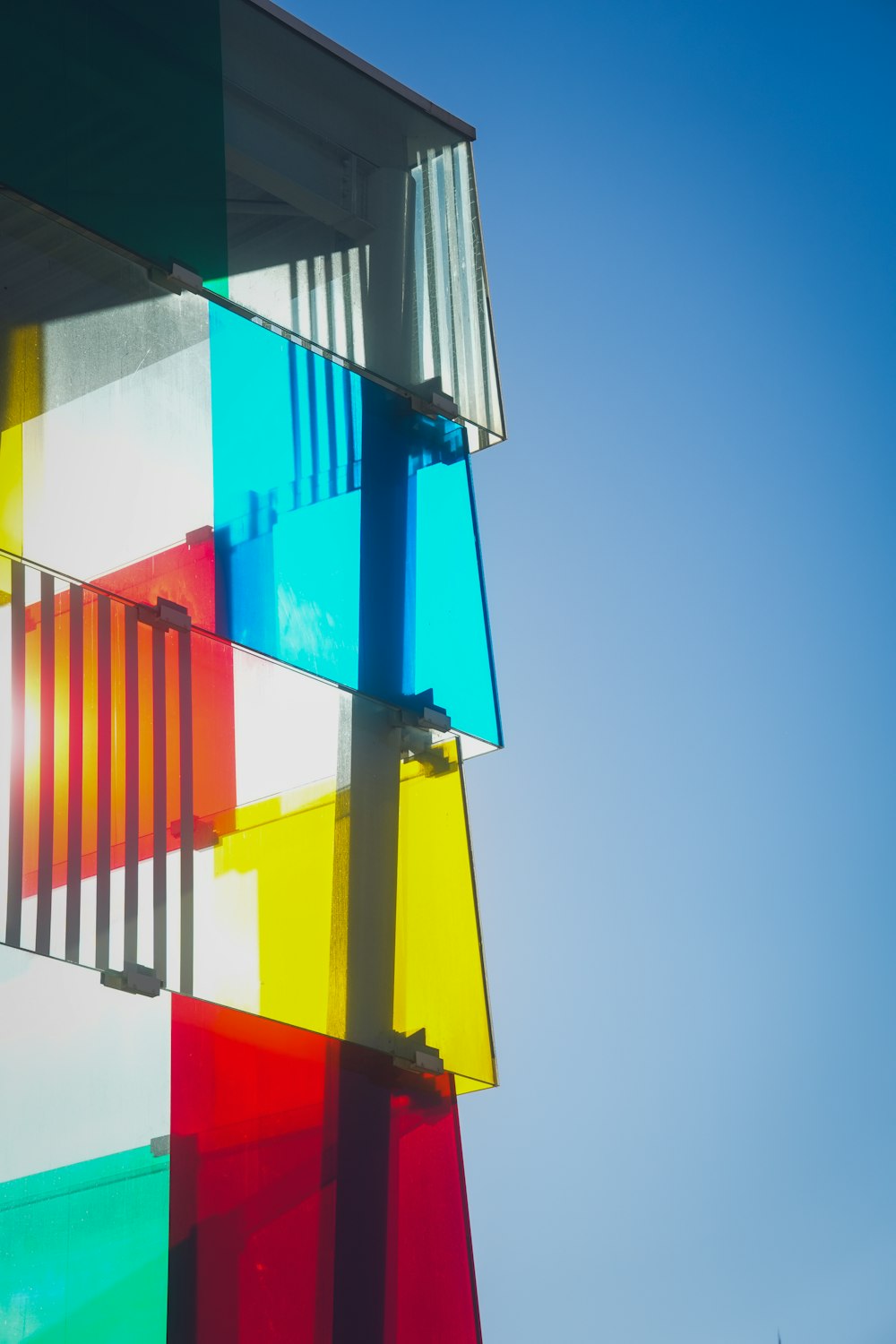 a multicolored building against a blue sky