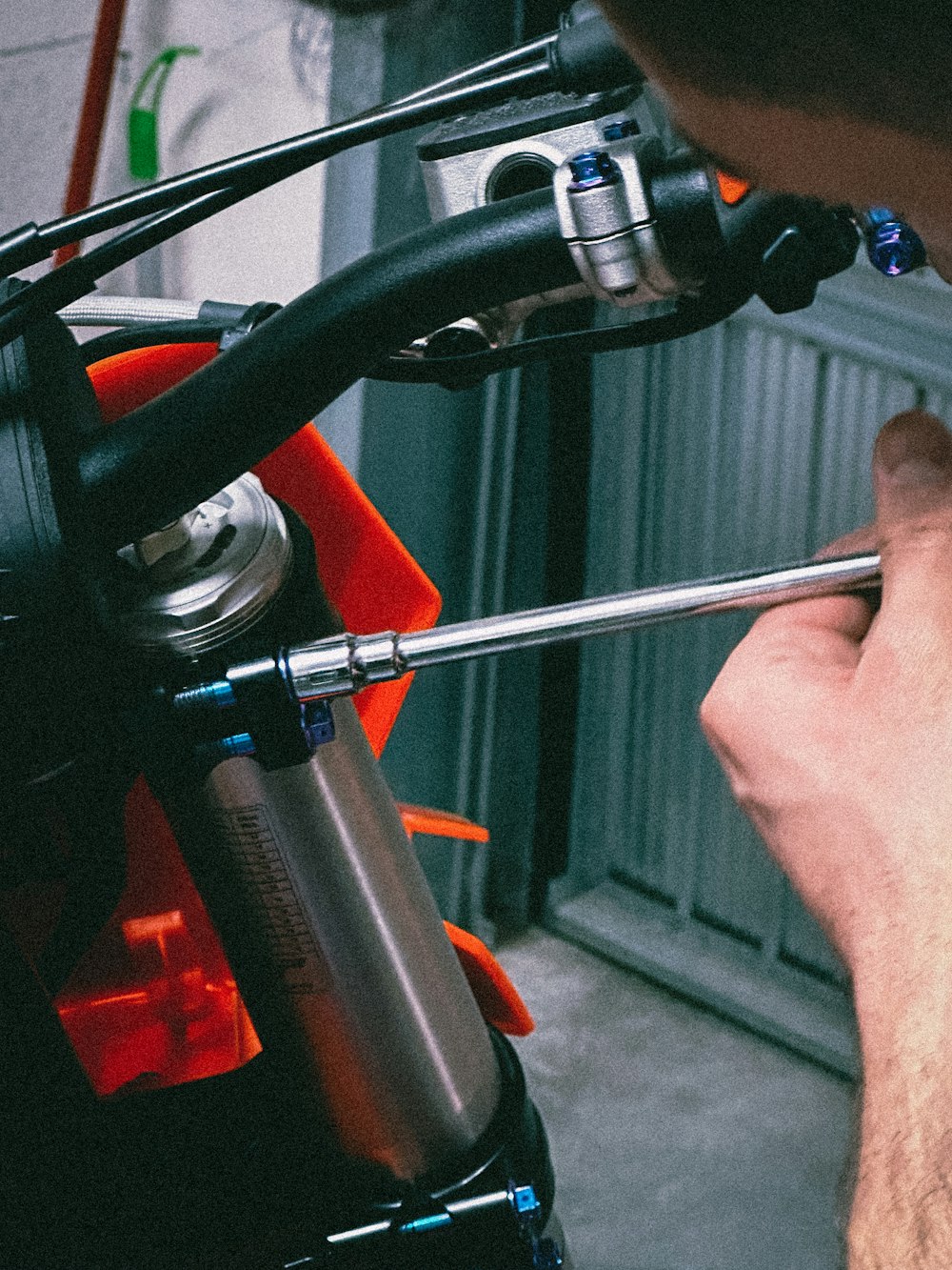 a man is holding a wrench in his hand