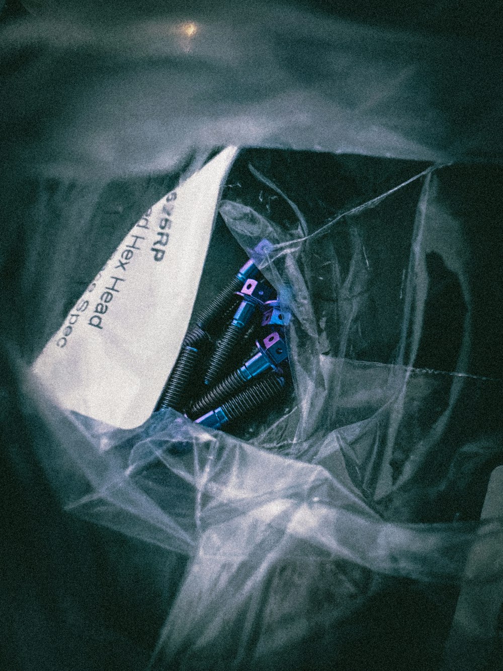 a plastic bag with some pens inside of it