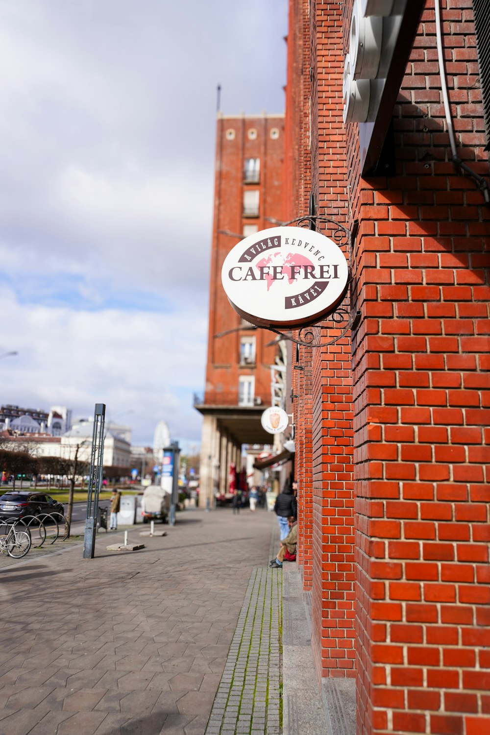 a red brick building with a sign on the side of it