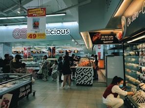 a group of people shopping in a store
