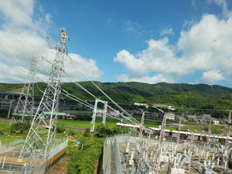 a view of a power line with a mountain in the background