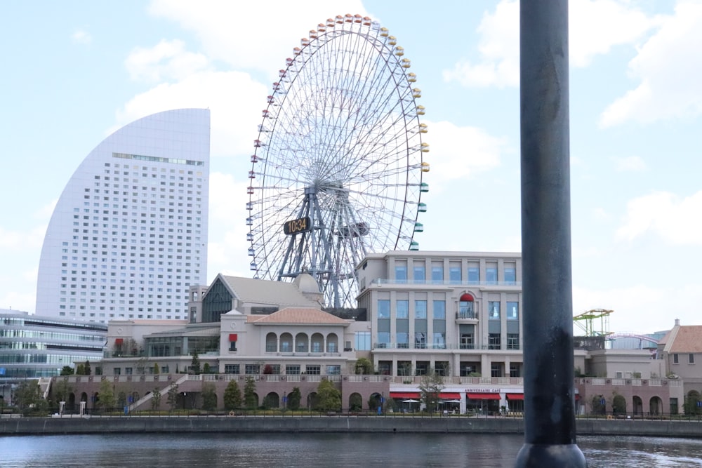 a large ferris wheel sitting next to a large building