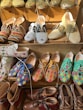 a bunch of shoes that are on a shelf