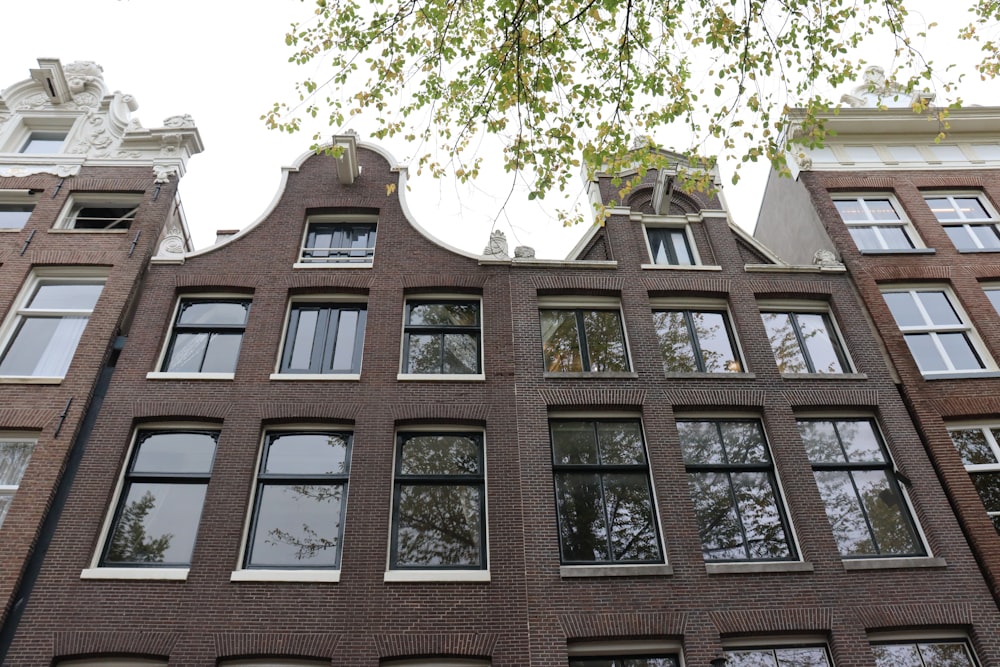 a tall brick building with lots of windows