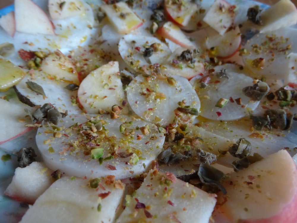 a close up of a plate of food with apples