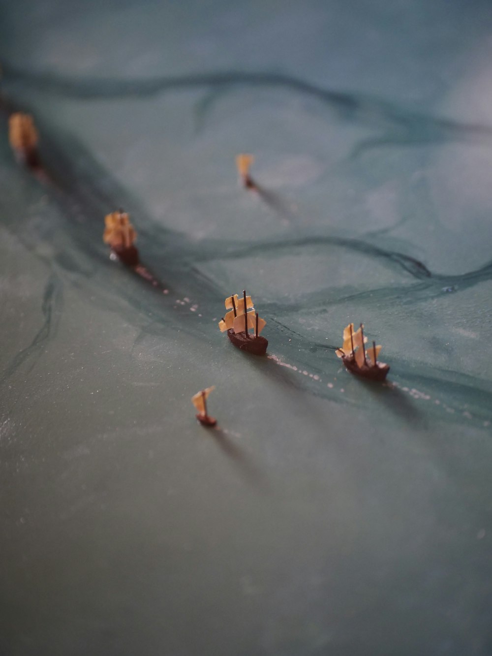 a group of small boats floating on top of a body of water