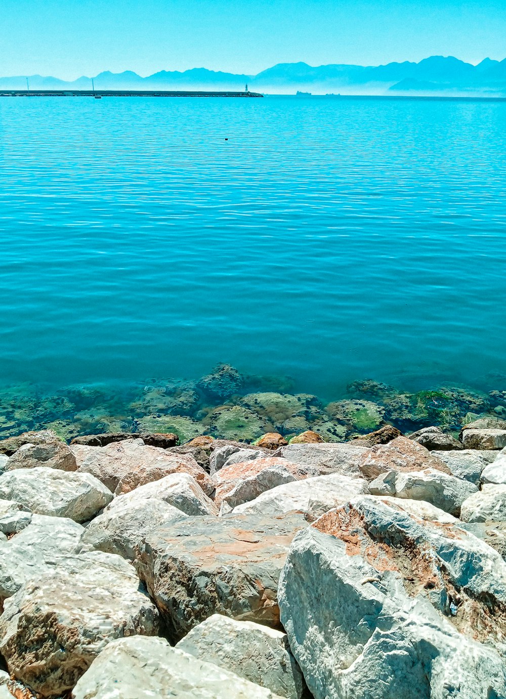 a large body of water surrounded by rocks