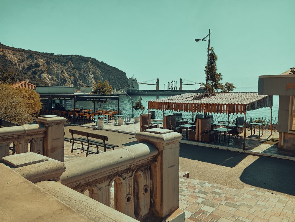 a view of a restaurant with a mountain in the background