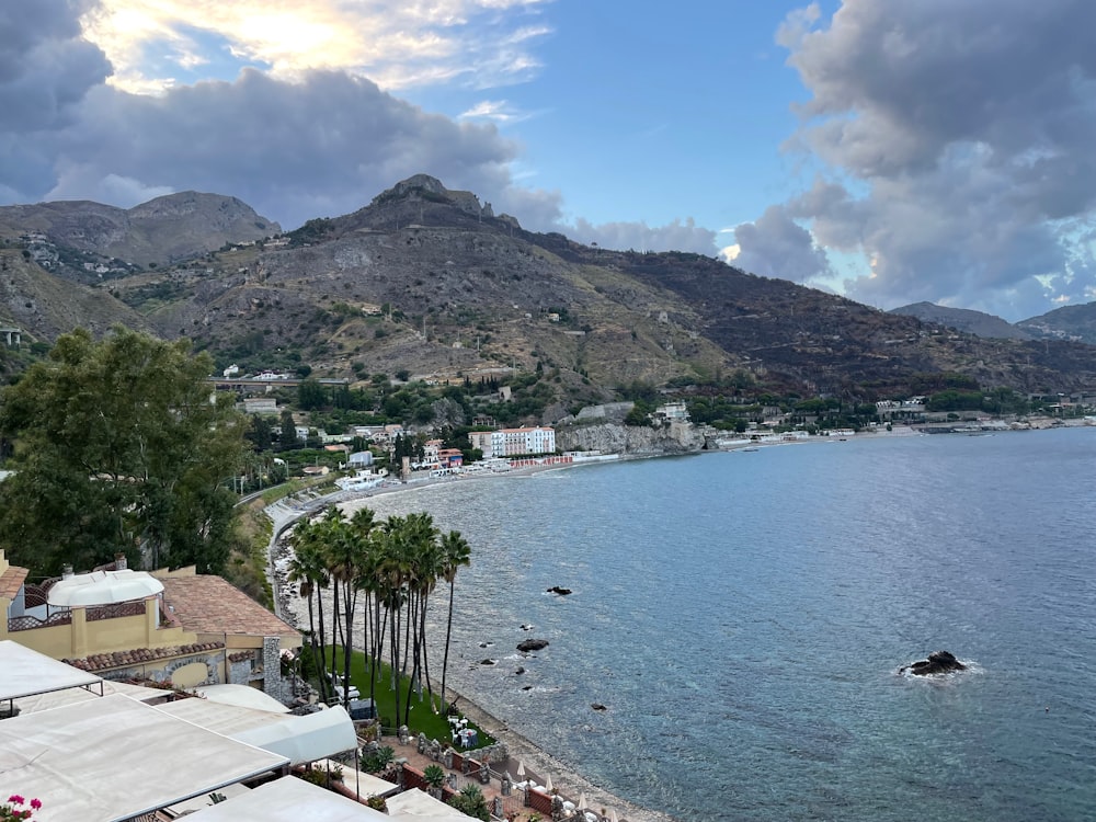 a view of a body of water with mountains in the background