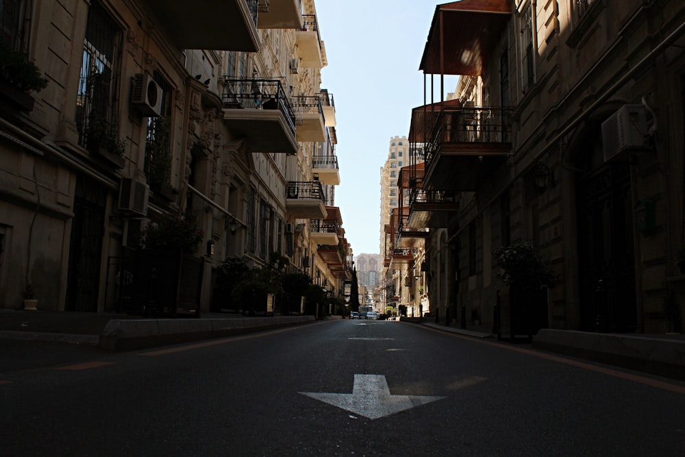 an empty street with a star painted on the road