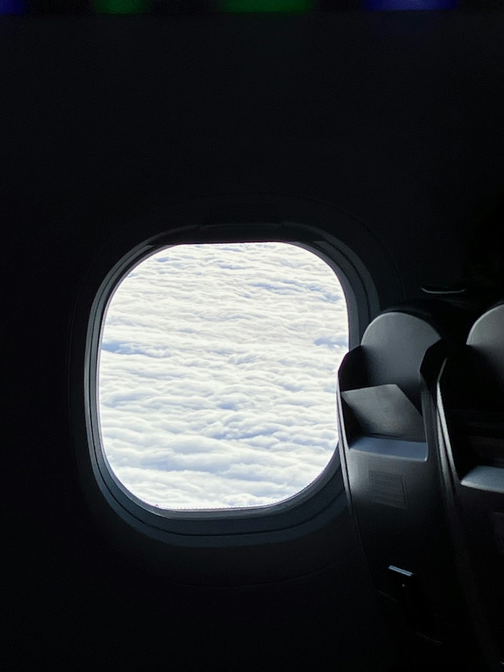 a view of the clouds through an airplane window