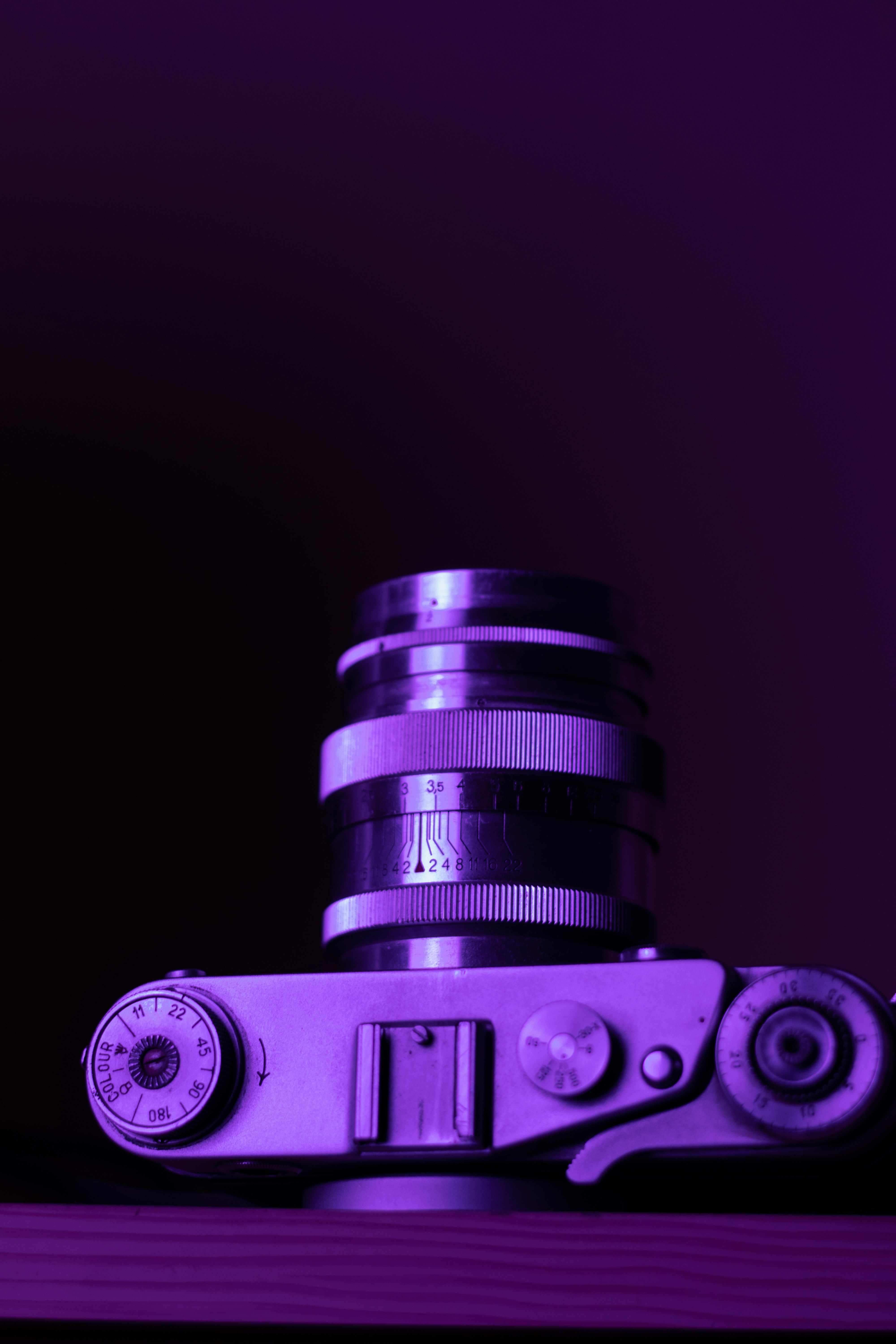 a camera sitting on top of a wooden table