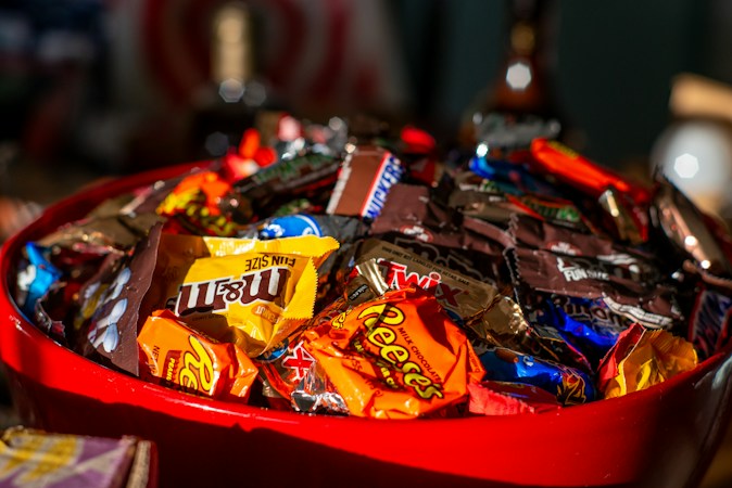 Red bowl filled with wrapped Halloween candy, like the treats donated for UNLV Boo Bash trick-or-treat stations